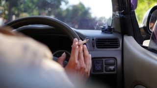 wildfire safety: someone smoking in a car