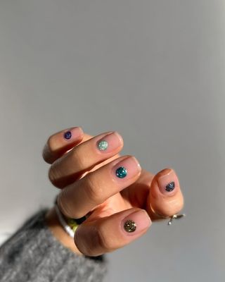 Minimalistic manicure featuring ornament-inspired art by Hang Nguyen