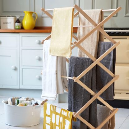 A wooden clothes airer with drying clothes