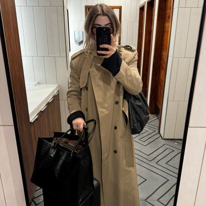 Christina Grasso wearing a chic airport outfit