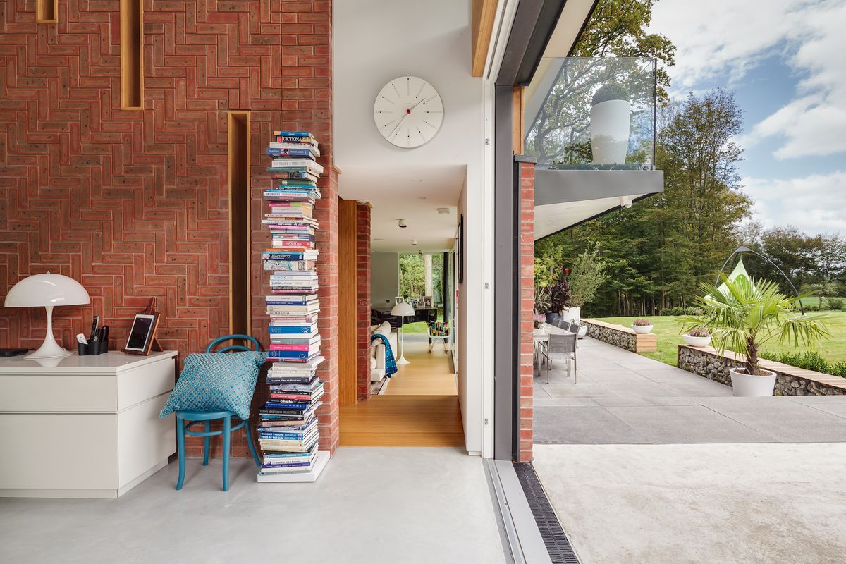 brick wall with timber clad hallway