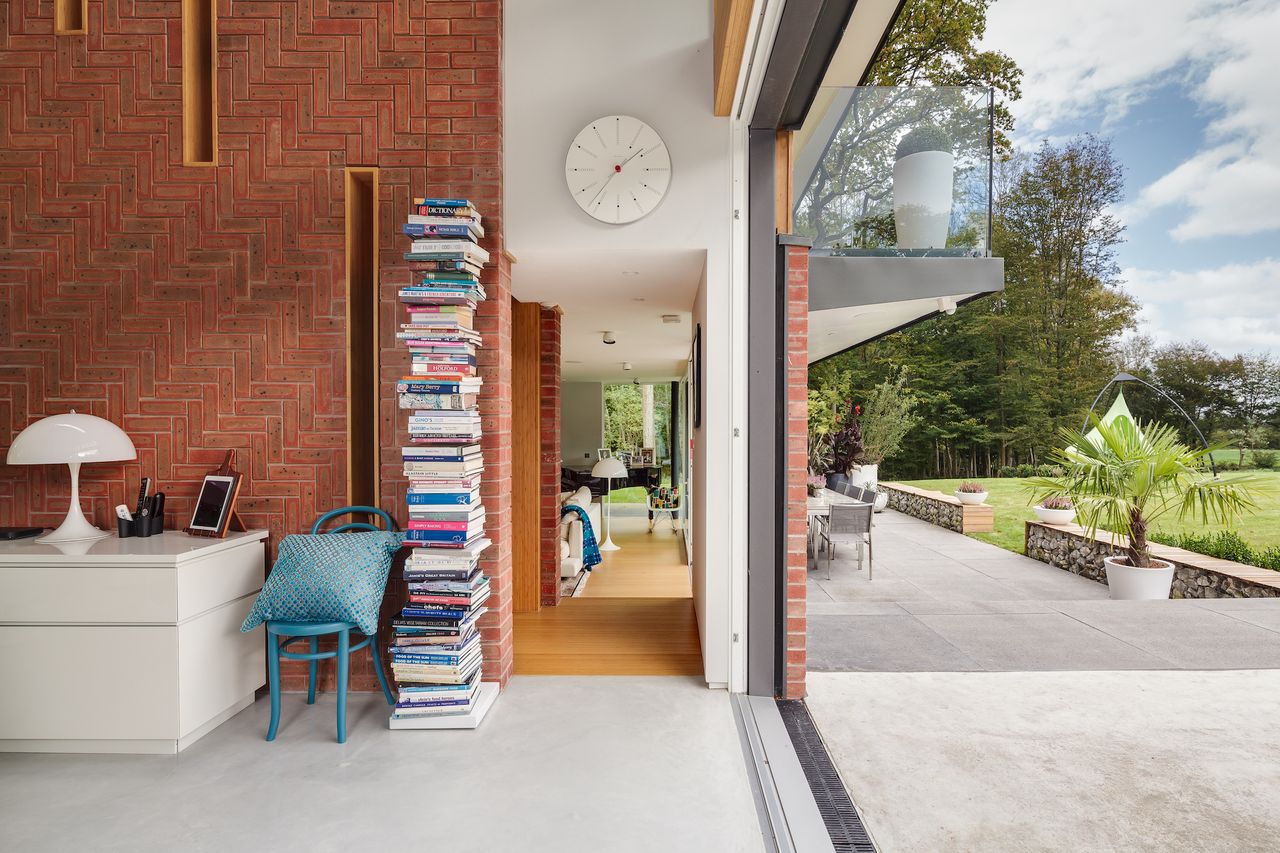 brick wall with timber clad hallway