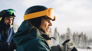 A close of up of two smiling skiers