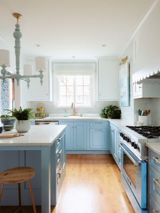 blue and white decor in a painted kitchen, with island and stove in the foreground