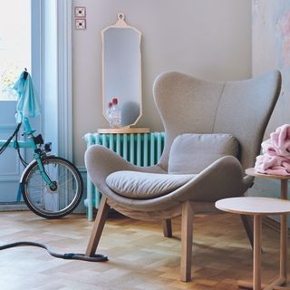 Living room with painted blue radiator.