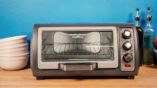 Hamilton Beach Easy Reach Toaster Oven being tested by writer
