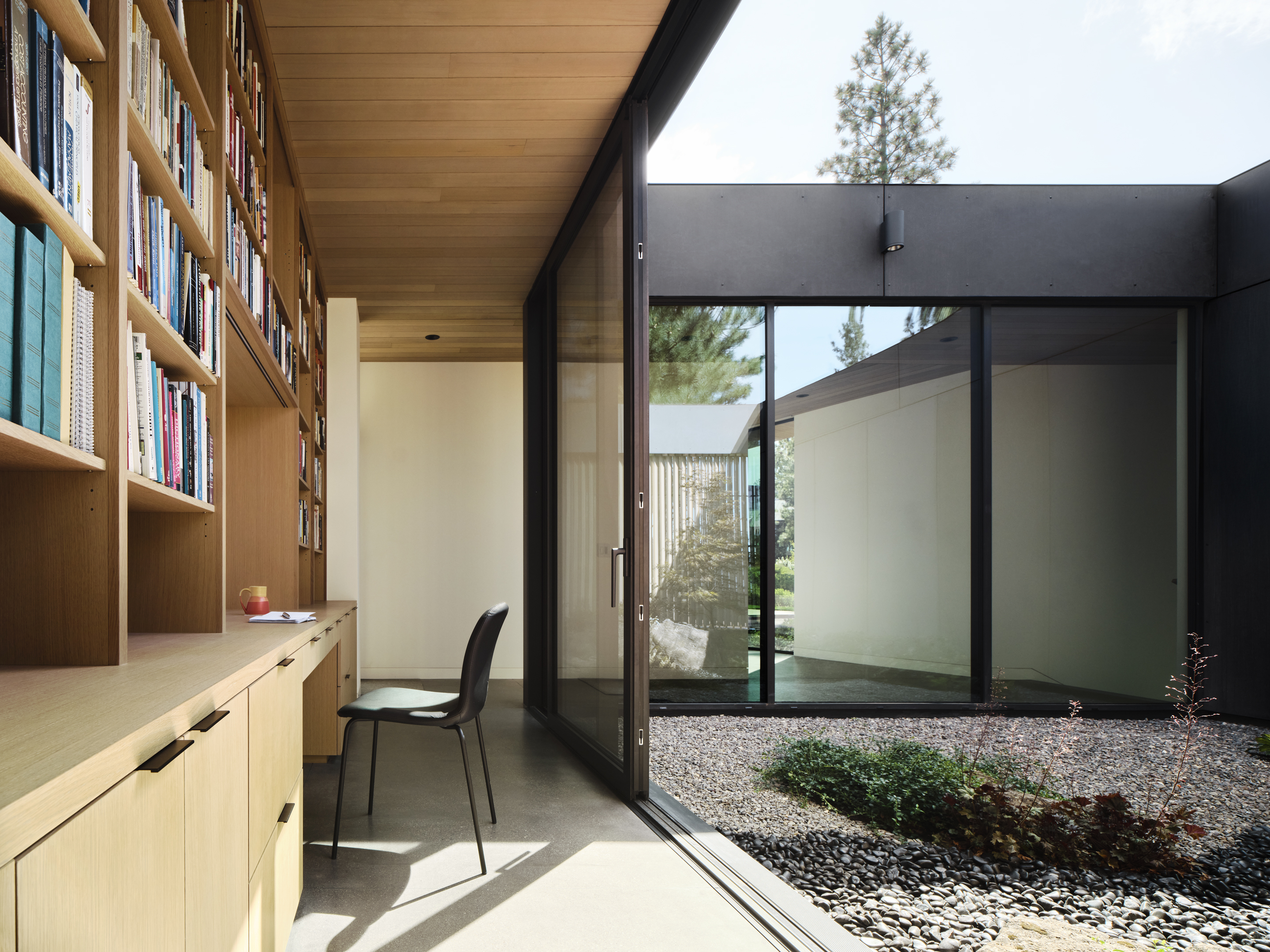 Image of an Oregon house, the Bend Hideaway, a linear modern home among trees and open to nature