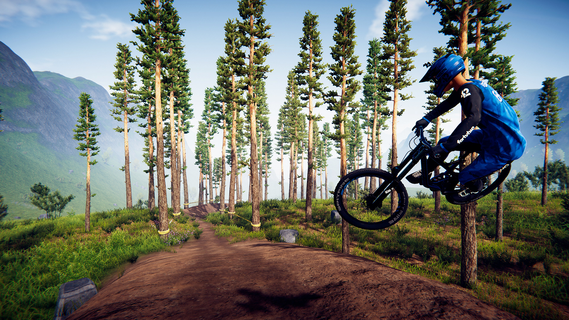 A cyclist performing a trick mid-air in Descenders