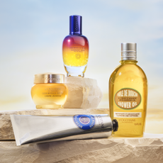 L'occitane beauty products on sandstone