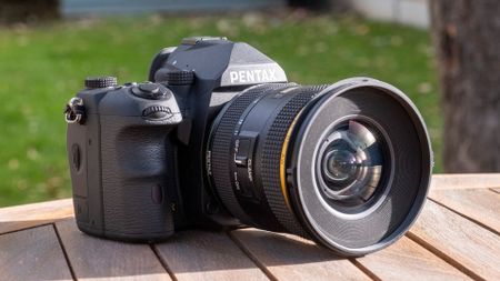 The Pentax K-3 III DSLR, showing the front of the camera and lens