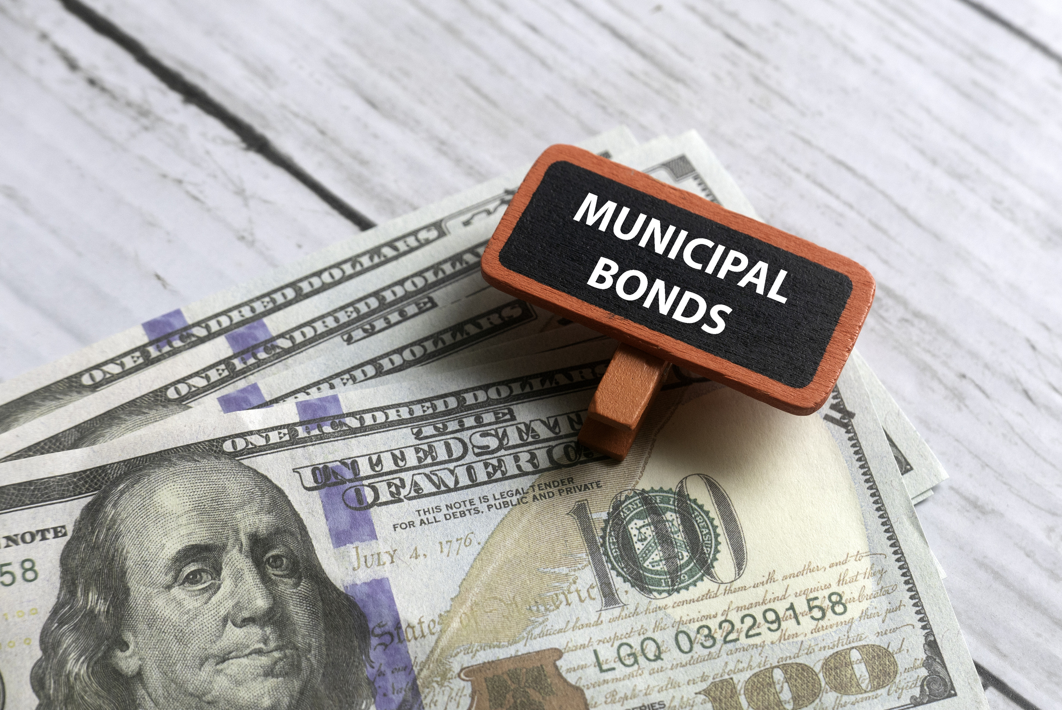 MUNICIPAL BONDS on white wooden background.