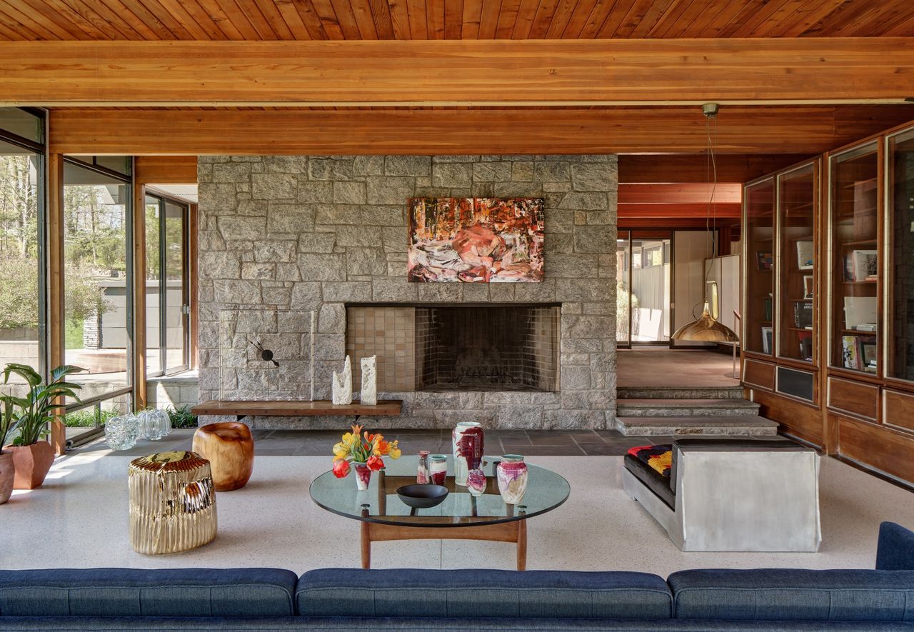 Living room with exposed brick &amp; large windows