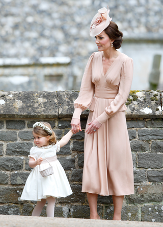 Catherine, Duchess of Cambridge and Princess Charlotte of Cambridge attend the wedding of Pippa Middleton and James Matthews at St Mark's Church on May 20, 2017 in Englefield Green, England