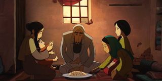 Parvana and her family share a meal in The Breadwinner