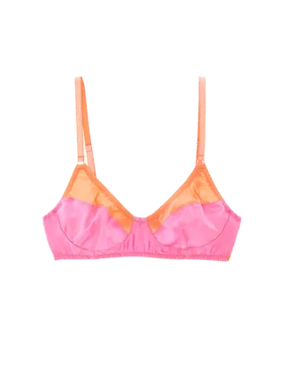 a silk araks bra in front of a plain backdrop in a guide to a katie holmes outfit