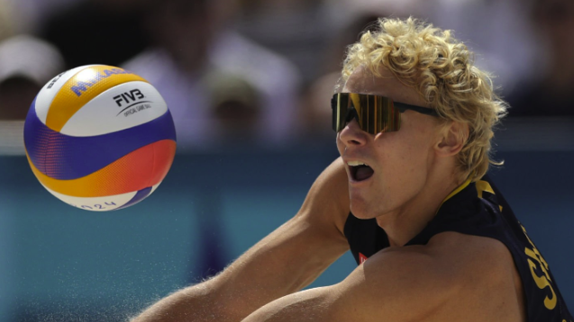 Sweden&#039;s #01 David Ahman digs the ball ahead of the Sweden vs Germany Men&#039;s Beach Volleyball final at Olympics 2024