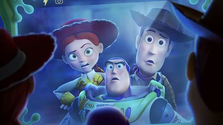 Woody, Buzz and Bo Peep in reflection on Lily Pad screen in Toy Story 5