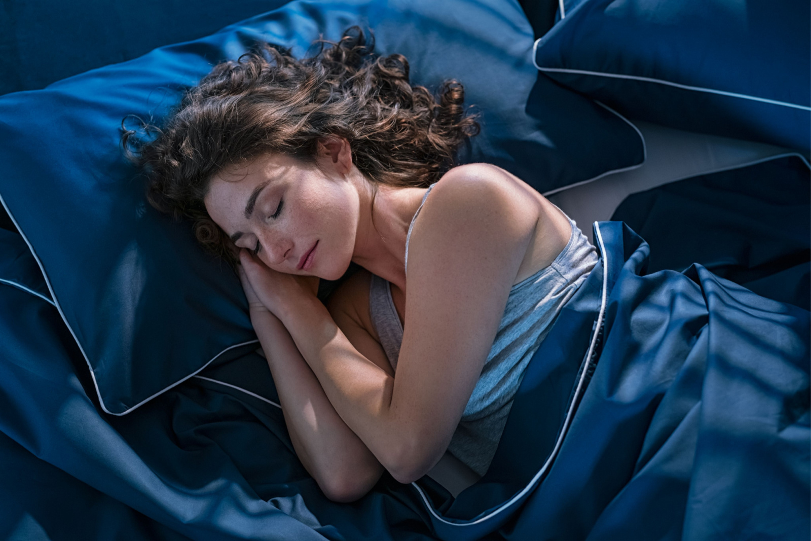 How To Get Better Sleep At Night In Addition To Navy SEAL Sleep Technique: Woman With Long Hair Sleeps Soundly In Bed