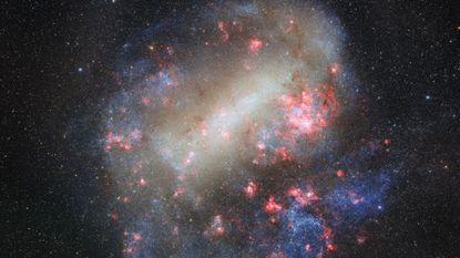 Swirls of white, purple and pink colors flow among bright dots for stars in the Large Magellanic Cloud as seen in space
