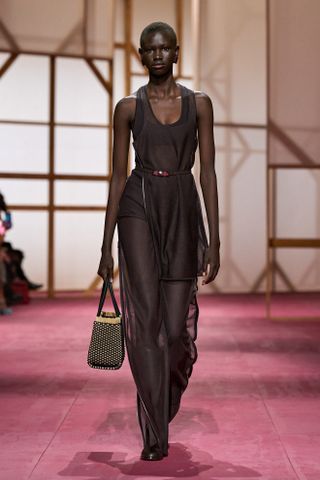 an Hermes model walks the spring/summer 2025 runway