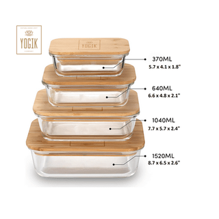 A set of four glass food storage containers with bamboo lids, stacked on top of one another