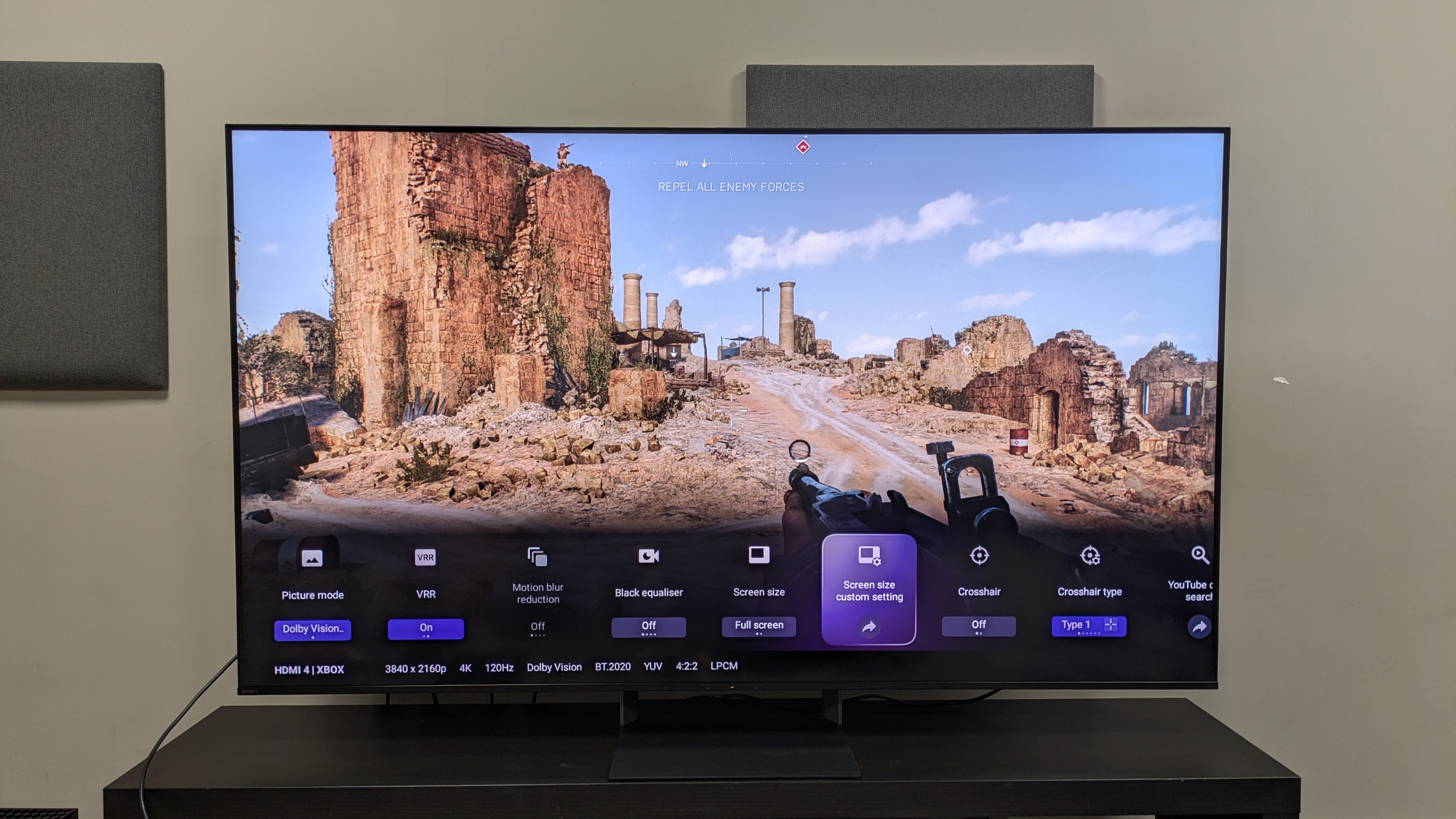 Sony Bravia 7 II with a shot of Battlefield V on screen, with the gaming menu overlay also on display