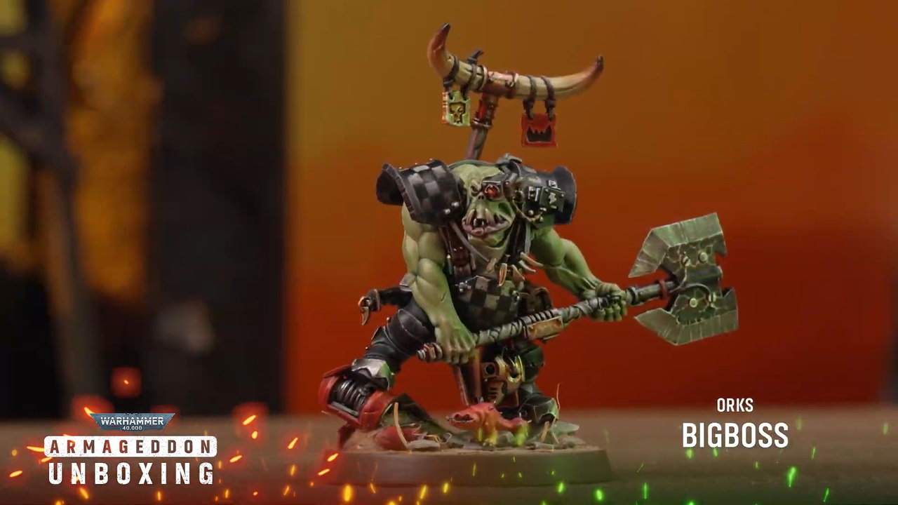 An Ork model against a fiery background