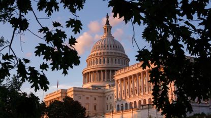 The U.S. Capitol building is seen at sunset.