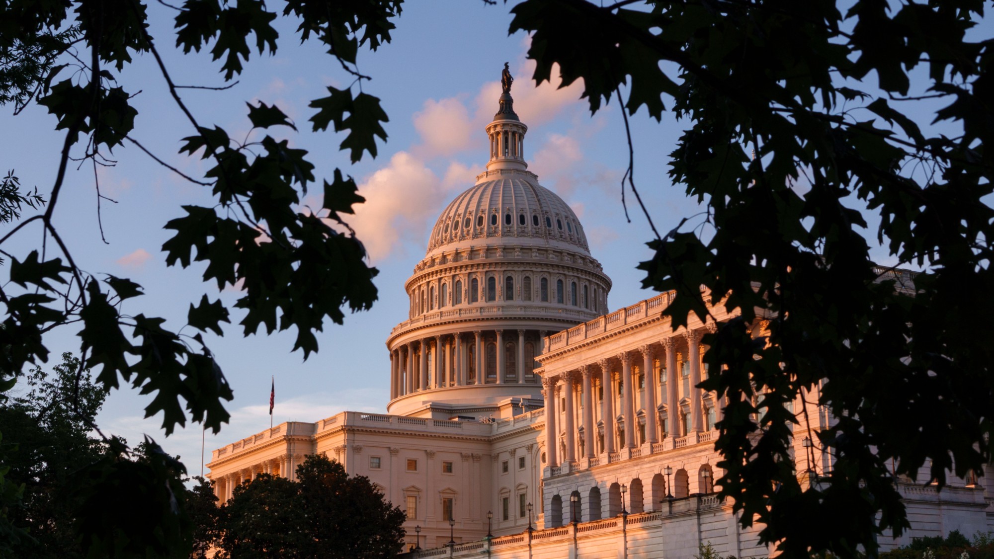 The U.S. Capitol building is seen at sunset. 