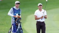 Collin Morikawa with caddie Mark Urbanek 