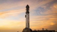 A towering SpaceX Starship rocket stands ready for Flight 13 launch amid a stunning pink sky in twilight.