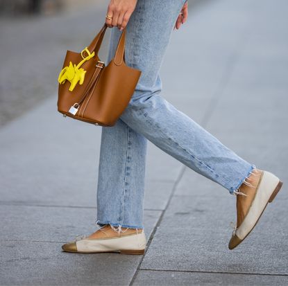 Woman walking in comfortable tan flats.