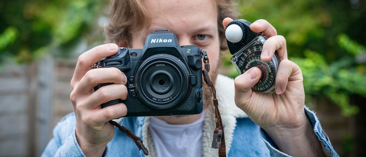 Sekonic Studio Deluxe III L-398A being held by man holding Nikon Z8