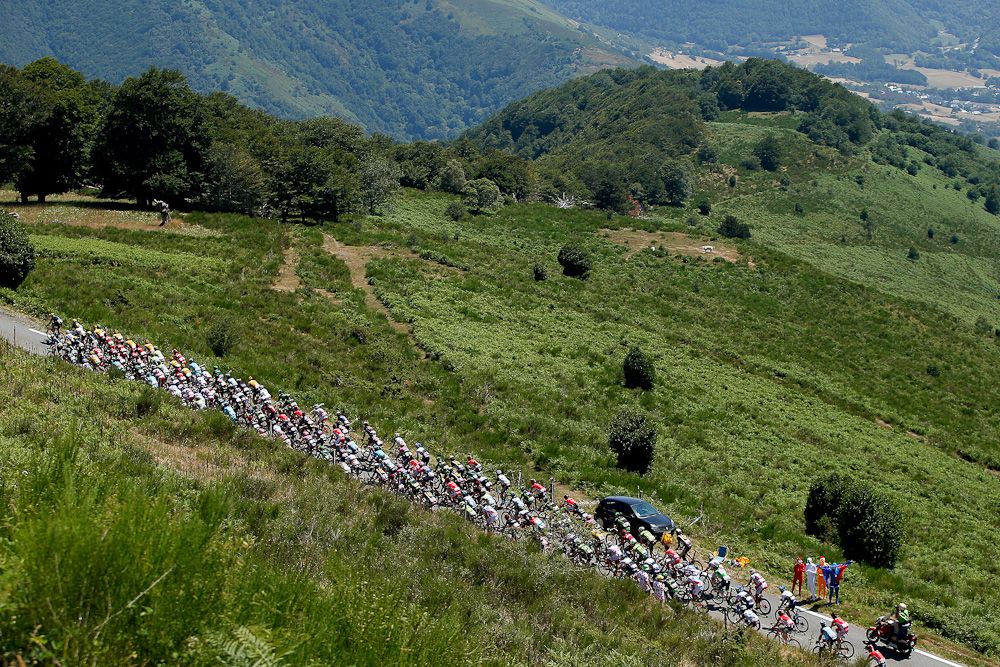 The peloton begins a climb during stage 11.