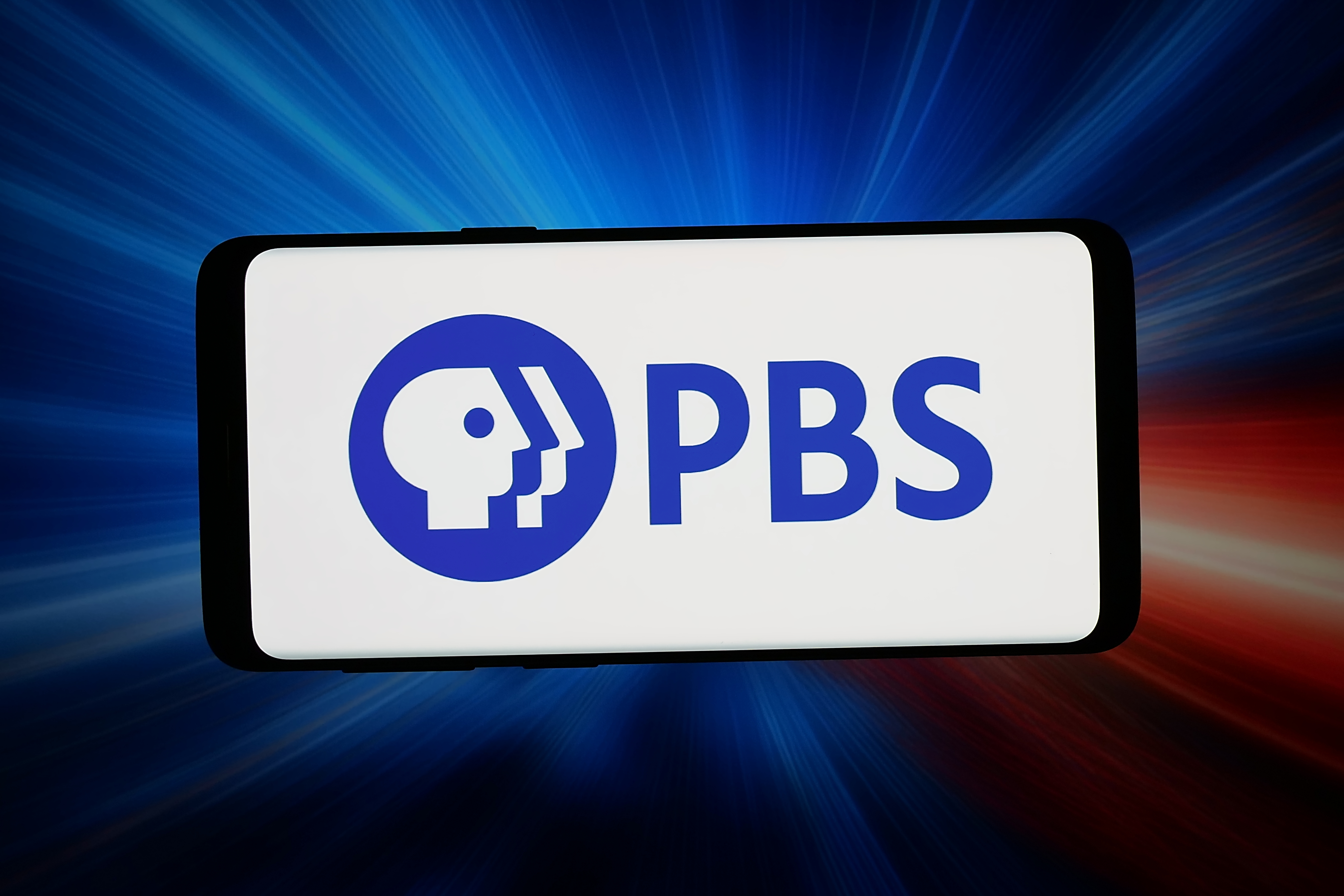 the PBS logo on a smartphone screen