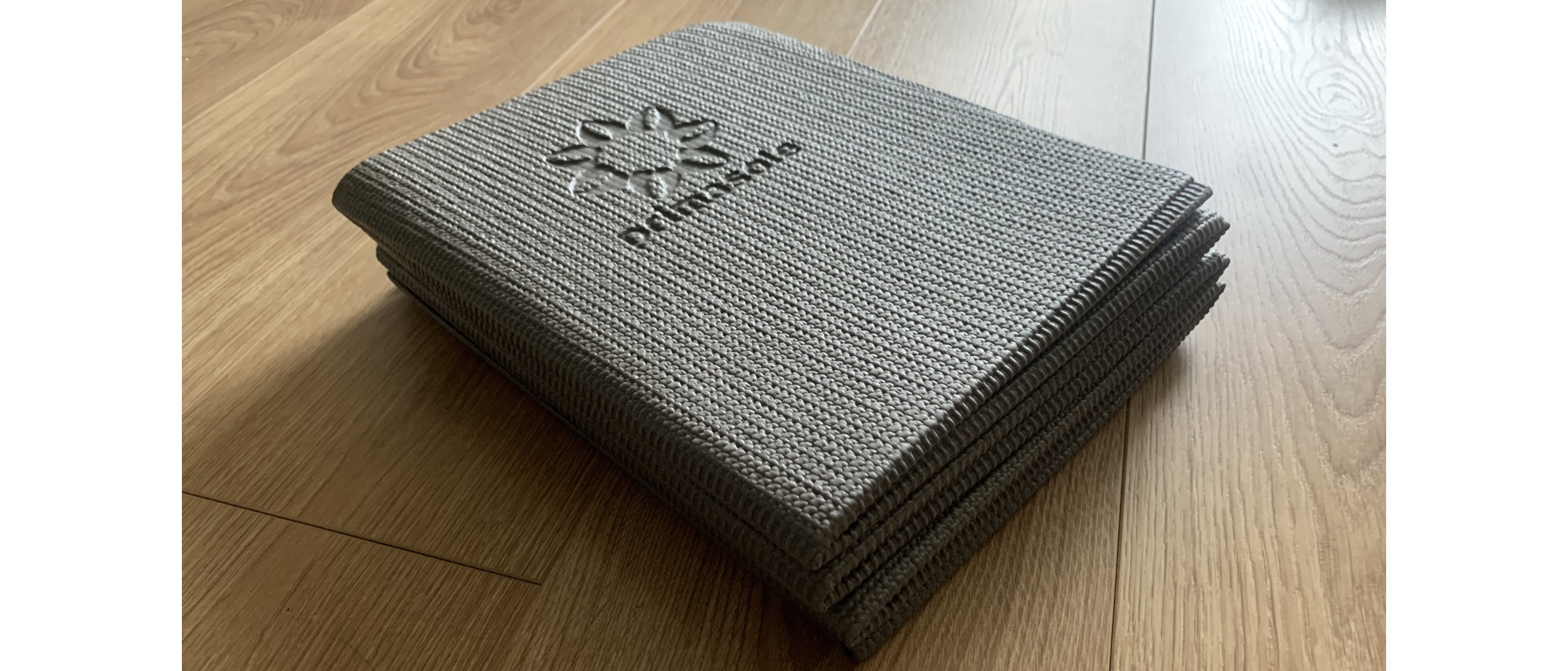 Best yoga mats: Primasole folding yoga mat folded into a square