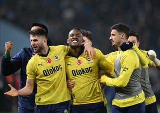 Michy Batshuayi celebrates with his Fenerbahce team-mates after victory against Trabzonspor in March 2024.