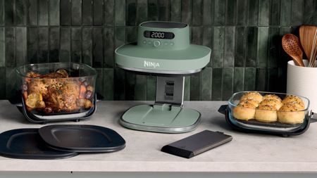 A green Ninja air fryer with a 6 and 4 quart basket either side. 