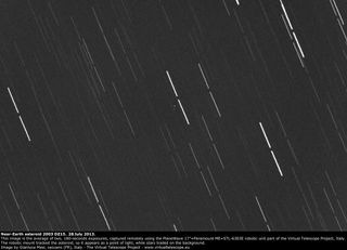 This image of near-Earth asteroid 2003 DZ15 was captured by the Virtual Telescope Project's PlaneWave instrument on July 27, 2013. The asteroid appears as a small white dot in the middle of the photo; the lines are star trails.