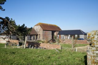 converted barns with interior timber frame for energy efficiency