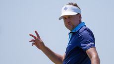 Ian Poulter acknowledges the crowd during a LIV Golf tournament