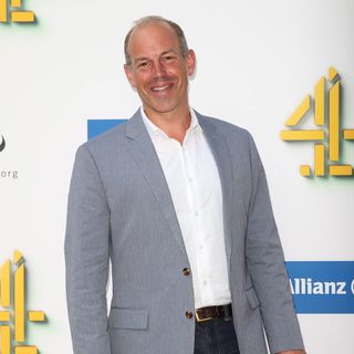 phil spencer with grey coat and white shirt