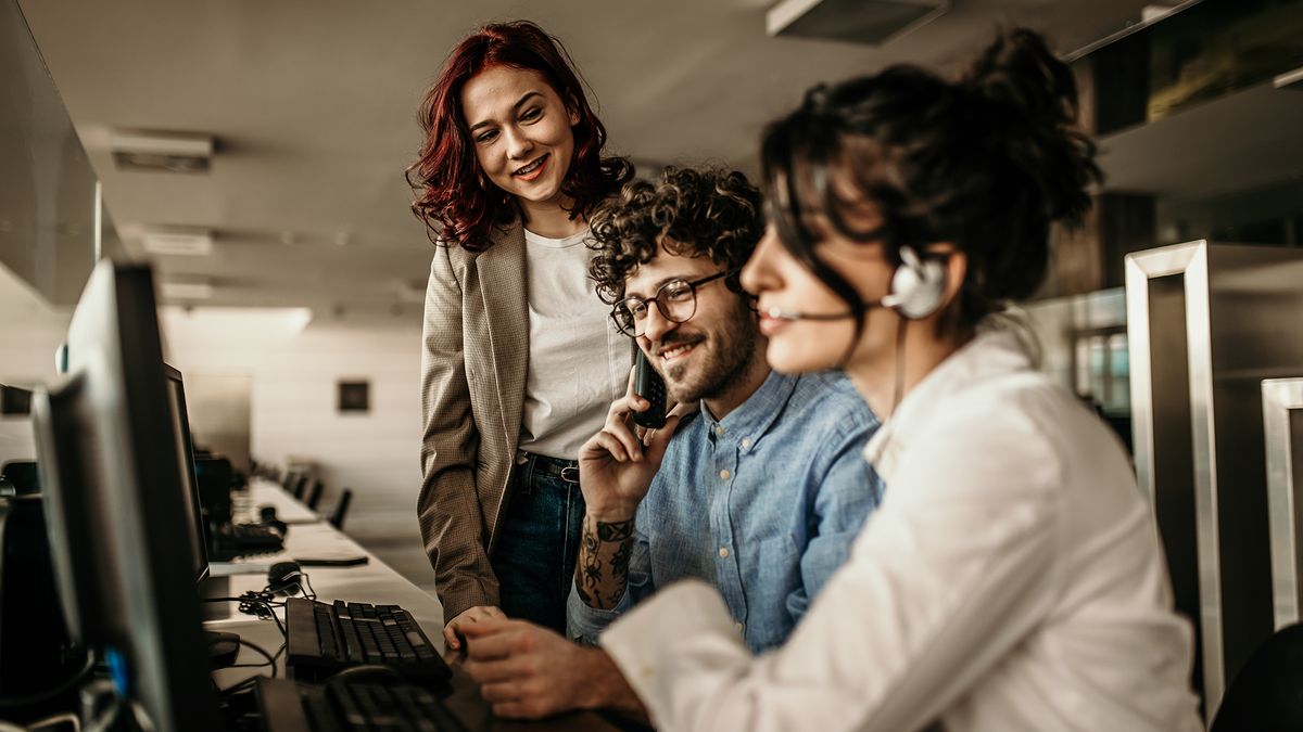 sales team in office making calls