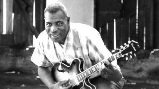 Blues musician Howlin’ Wolf playing guitar in 1968