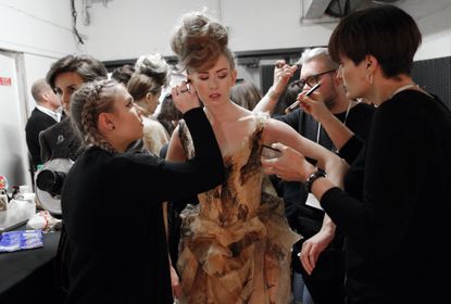 A models is made up backstage prior to the show on Jan. 25, 2017.
