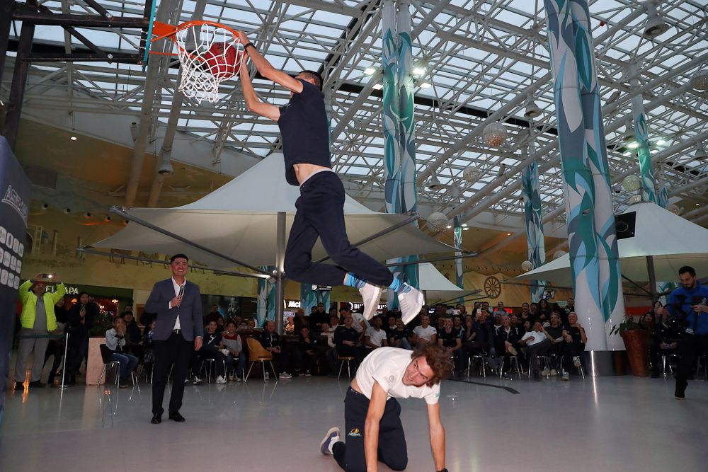 An Astana rider gets an assist to dunk the ball