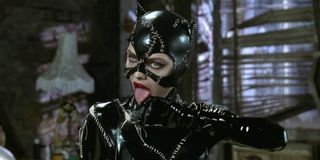 Catwoman licking her hand in Batman Returns