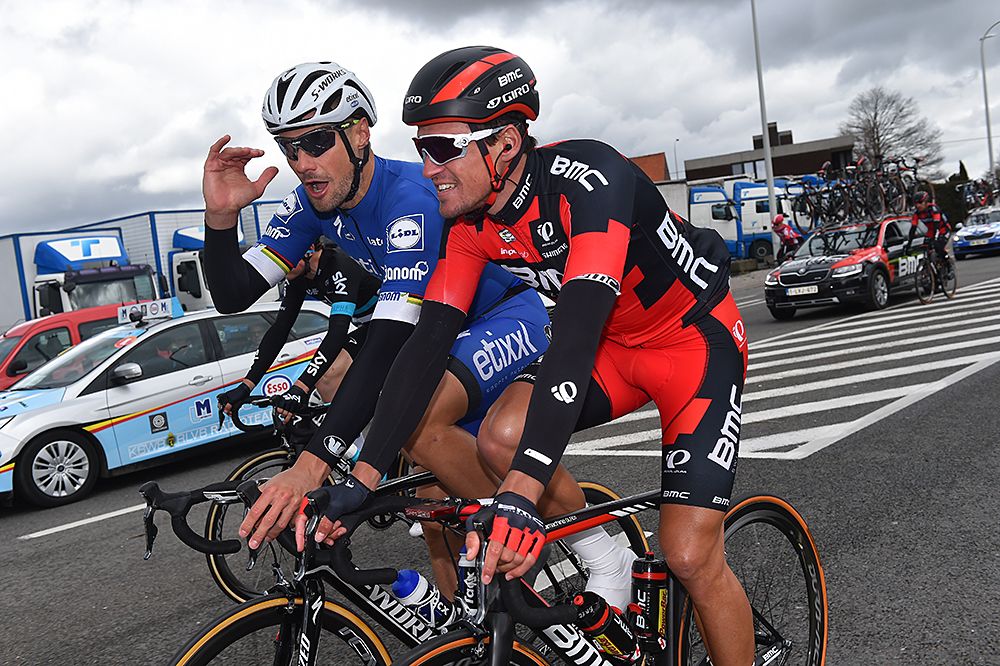 Greg Van Avermaet (BMC) and Tom Boonen (Etixx-QuickStep) have a chat during Gent-Wevelgem