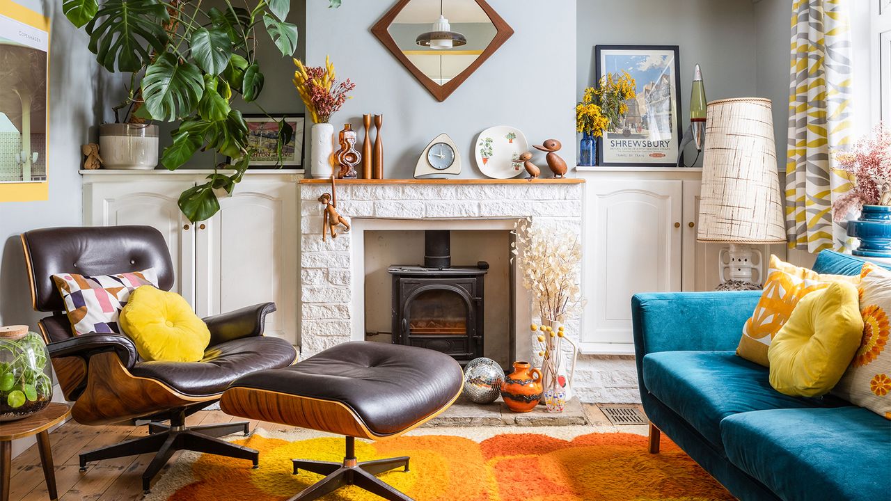 blue living room with fireplace and retro furniture