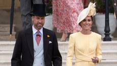 Prince William and Catherine, Princess of Wales walk down the steps at the start of a Royal Garden Party at Buckingham Palace on May 20, 2025